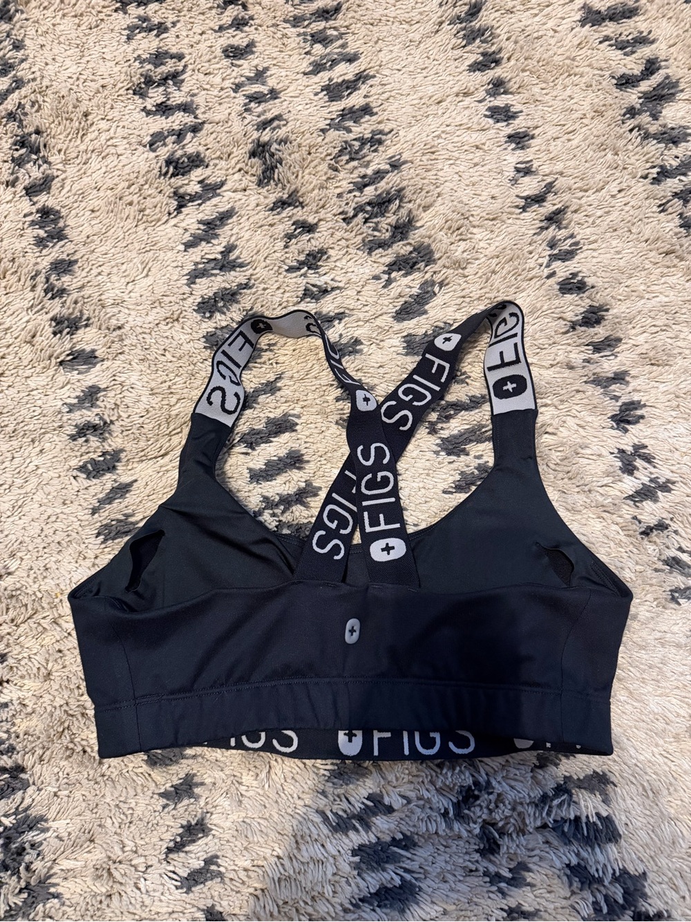 black FIGS Performance Underscrub Sports Bra featuring branded crossback straps - Picture 2 of 4